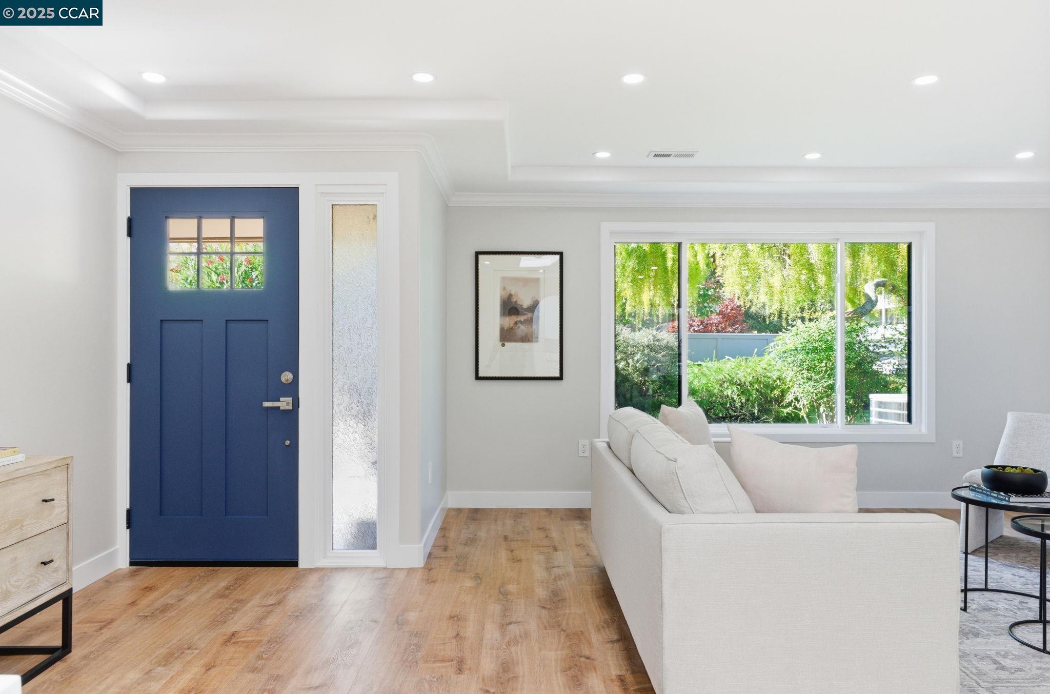 2132 Golden Rain Road, Unit 2 Walnut Creek, CA 94595 - Photo 26 of 38 a living room with furniture and a large window
