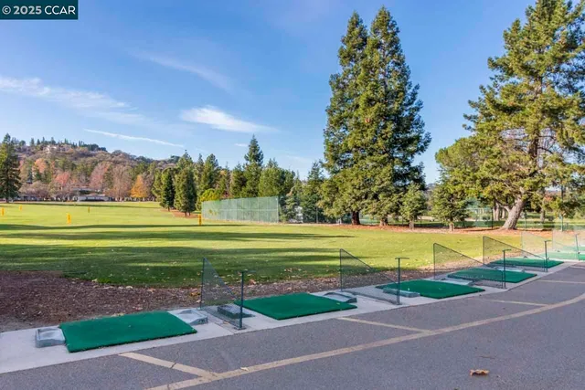 a view of a golf course with a lake