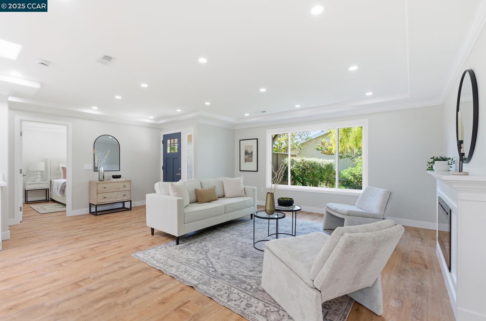 2132 Golden Rain Road, Unit 2 Walnut Creek, CA 94595 - Photo 10 of 38 a living room with furniture and a flat screen tv