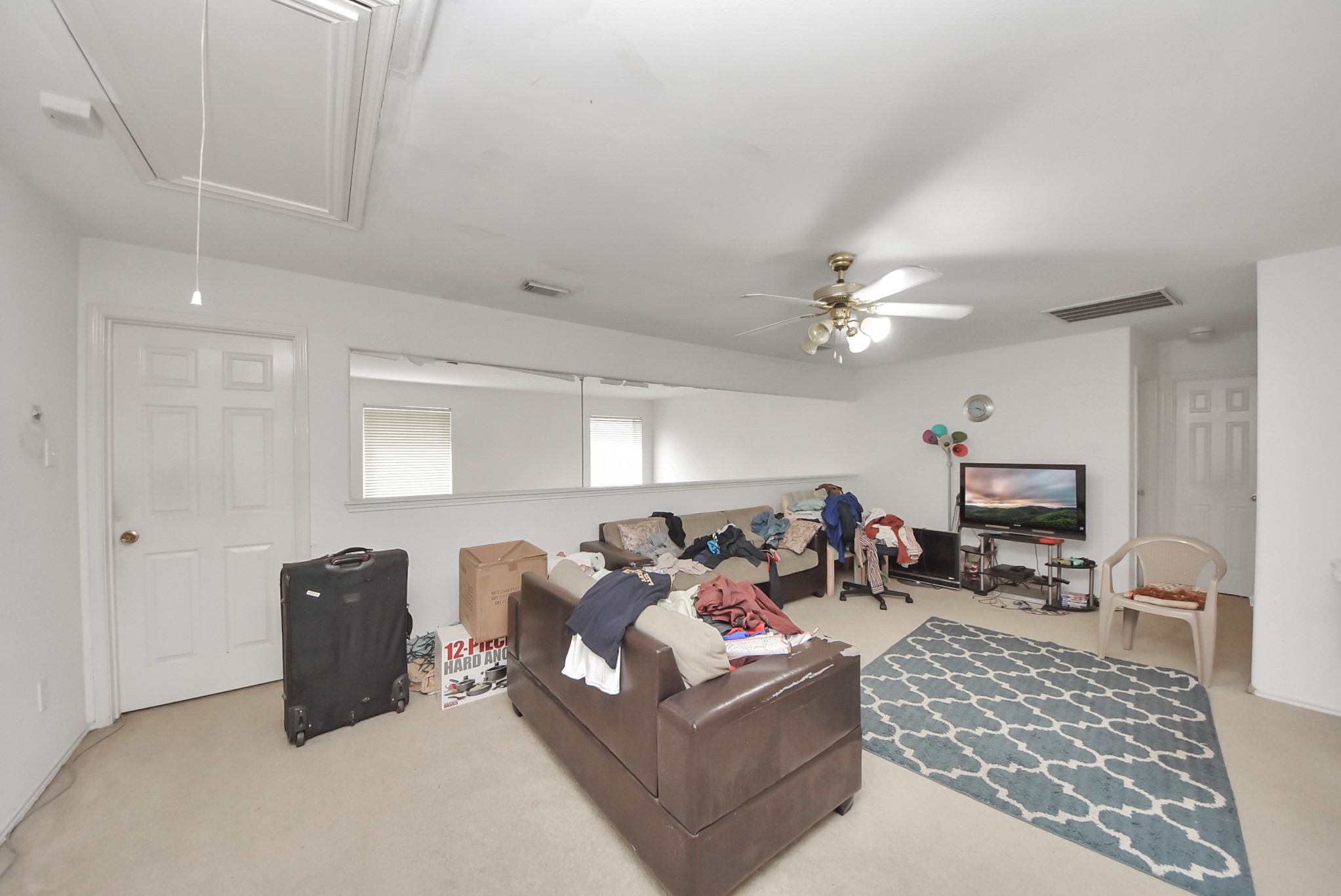 10003 Dakota Ridge Court Houston, TX 77095 - Photo 16 of 30 a living room with furniture and a chandelier