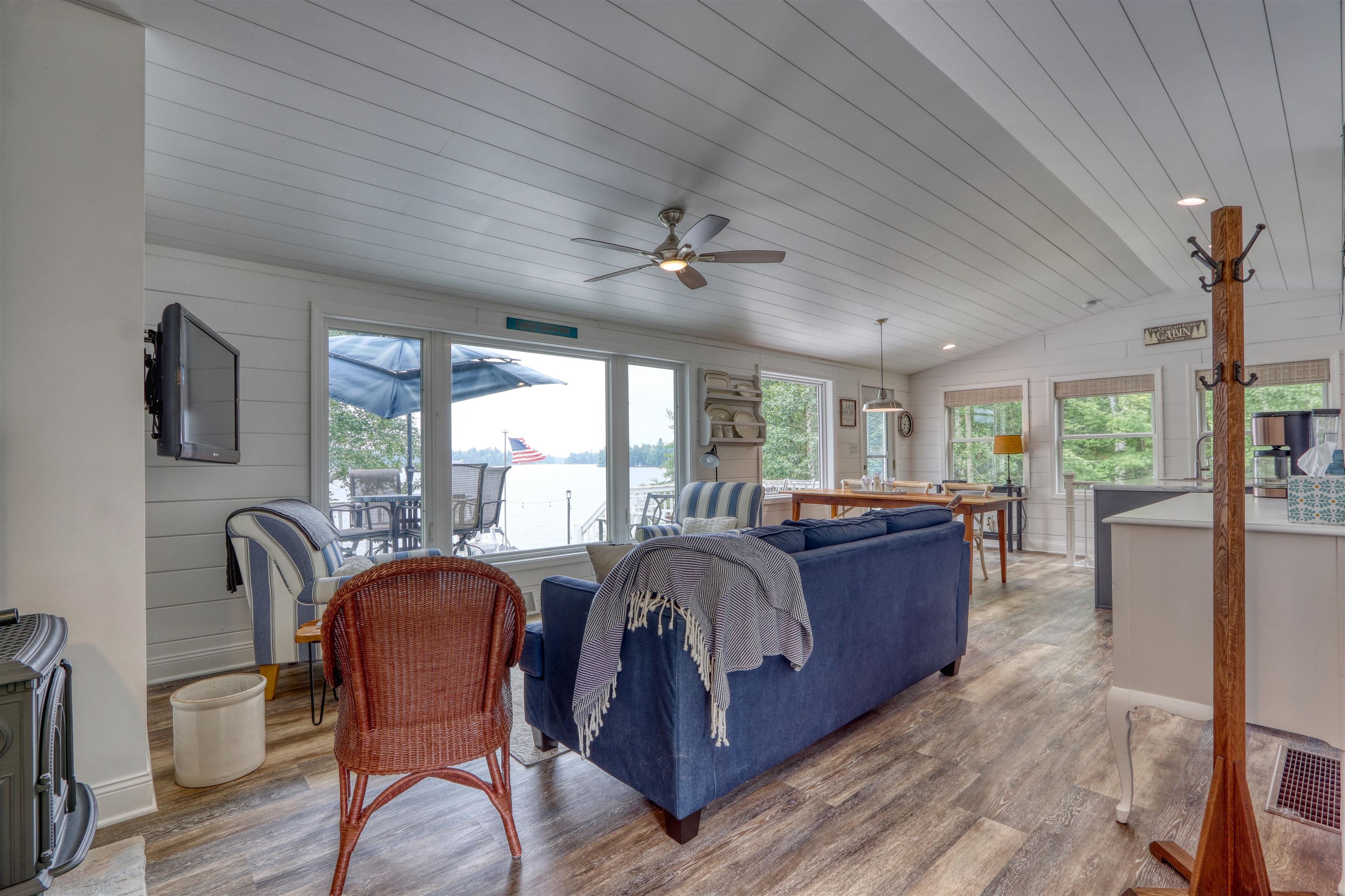 7144 Malm Road Winter, WI 54896 - Photo 15 of 58 Living room with wood ceiling, lofted ceiling, wood finished floors, and ceiling fan