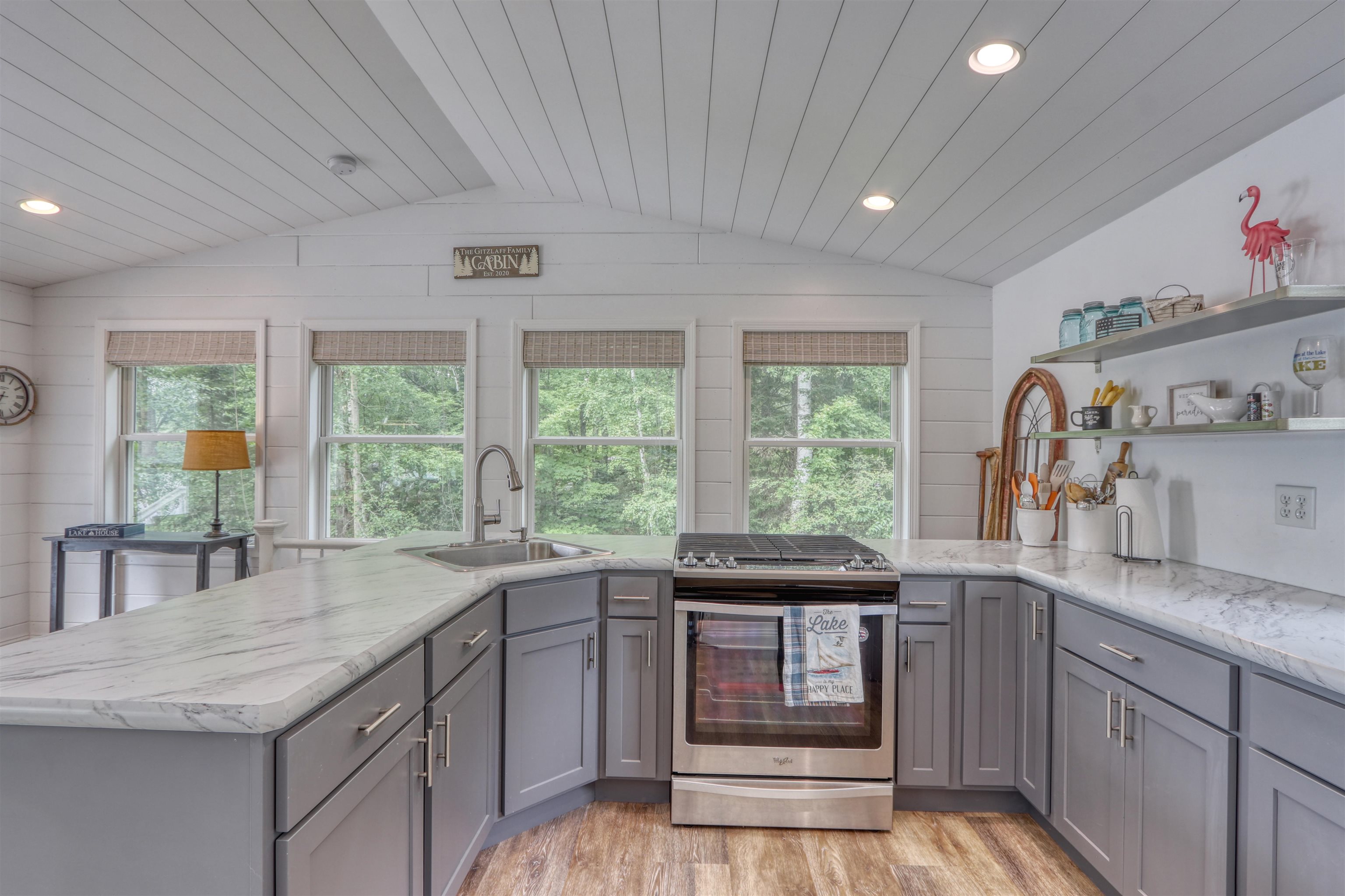 7144 Malm Road Winter, WI 54896 - Photo 22 of 58 Kitchen with gray cabinets, stainless steel range, recessed lighting, open shelves, and light wood-style floors