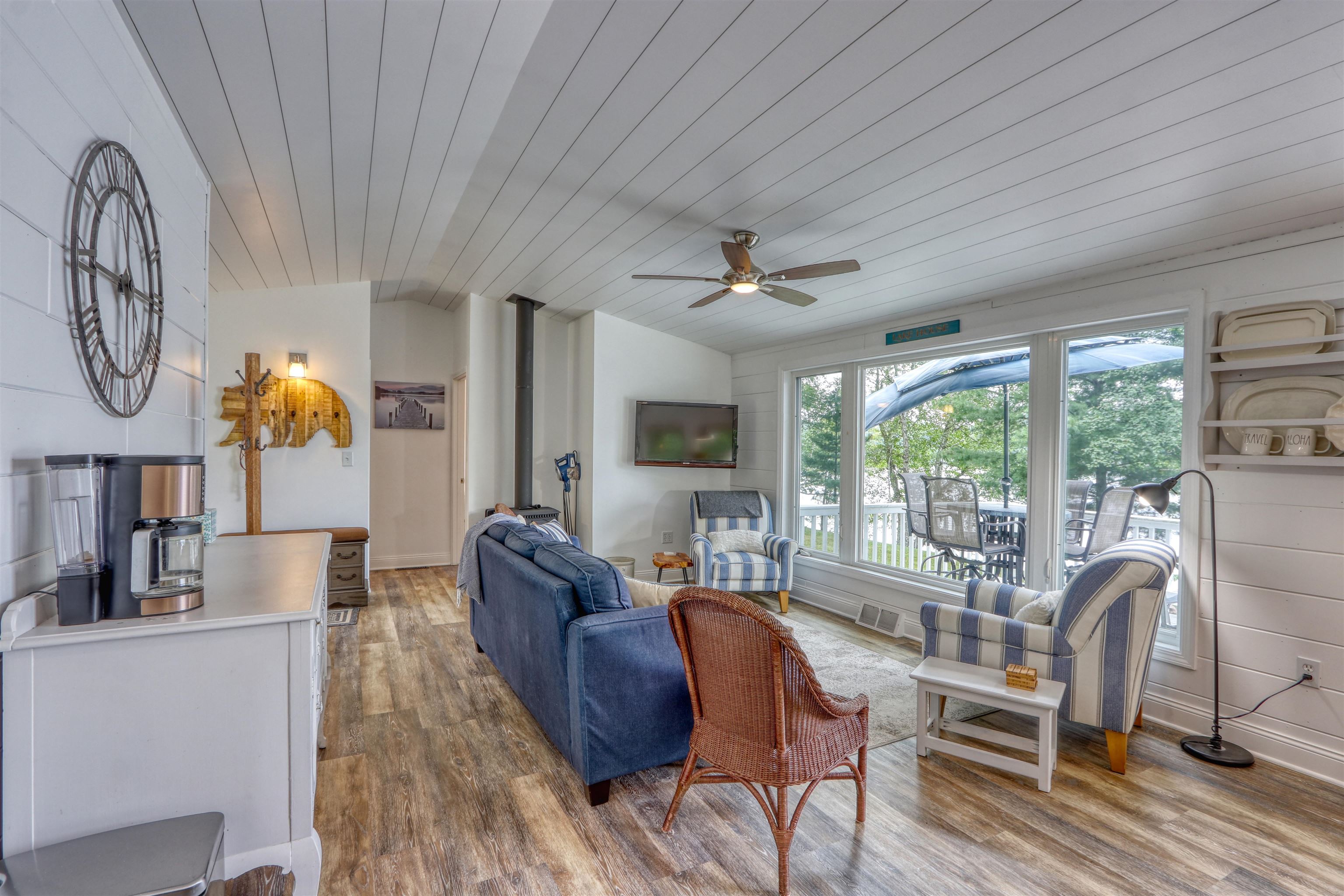 7144 Malm Road Winter, WI 54896 - Photo 26 of 58 Living room with wood finished floors, wood ceiling, a ceiling fan, and lofted ceiling