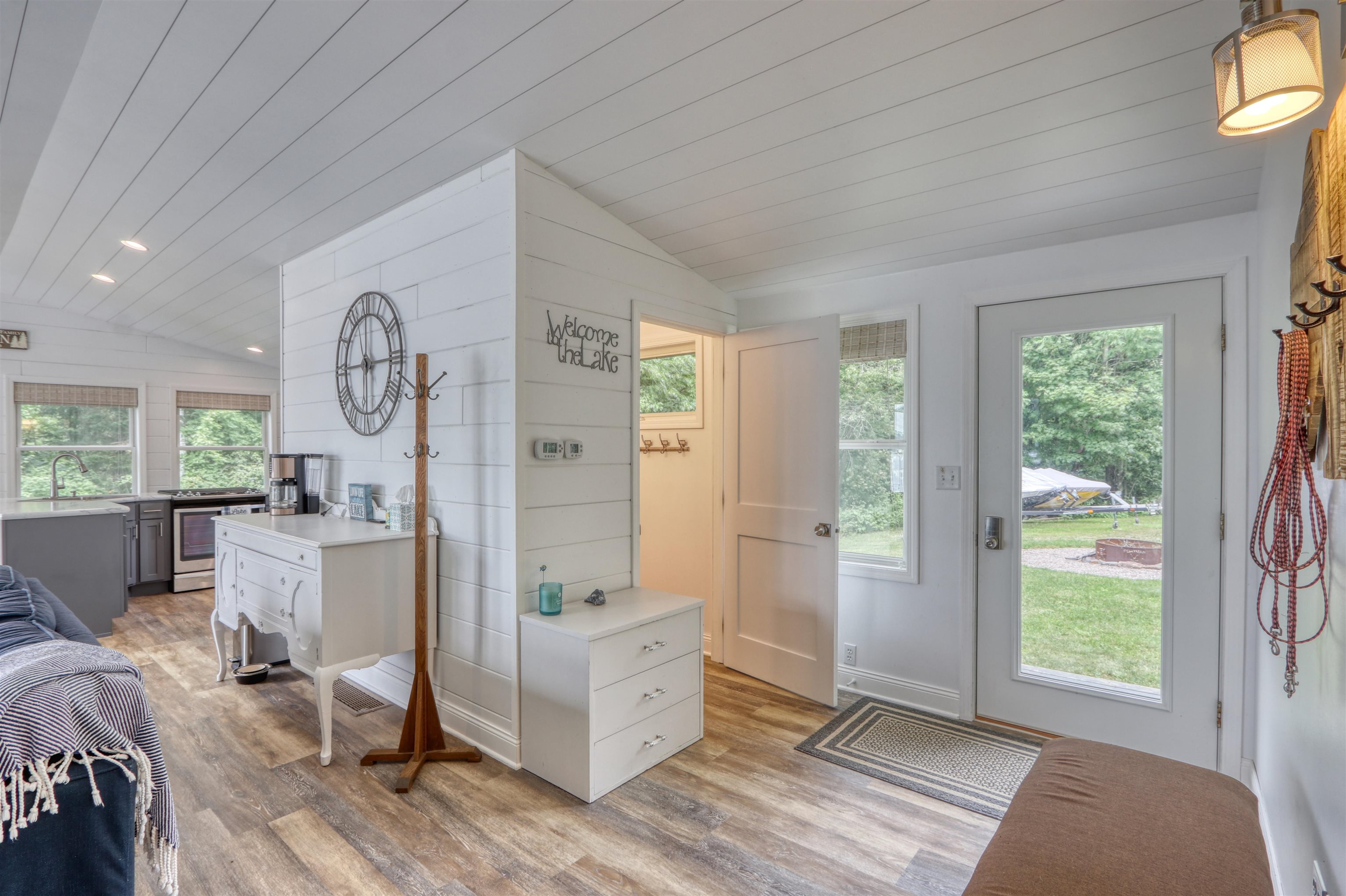 7144 Malm Road Winter, WI 54896 - Photo 33 of 58 Entryway with lofted ceiling, light wood finished floors, wood ceiling, and recessed lighting