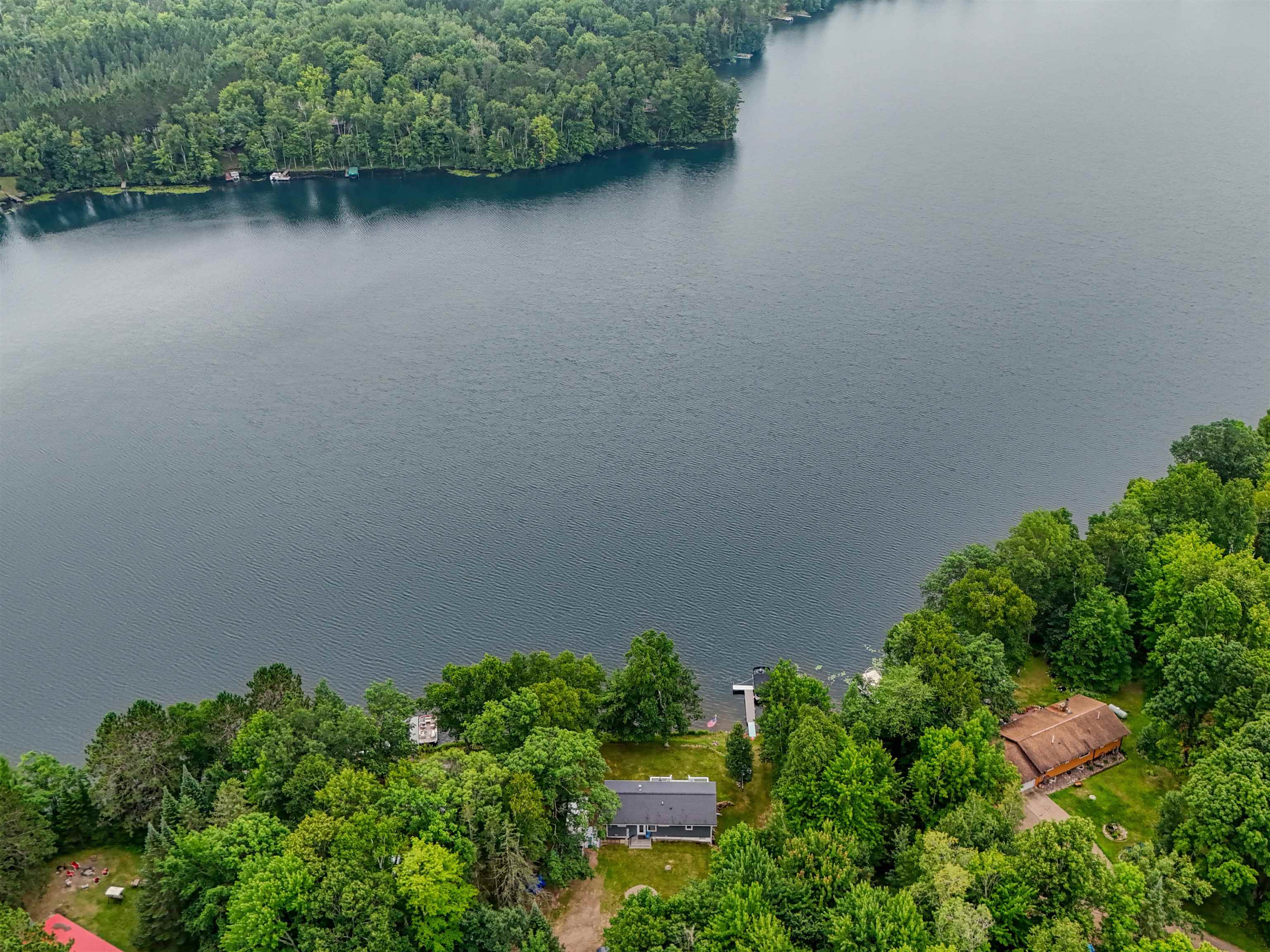 7144 Malm Road Winter, WI 54896 - Photo 4 of 58 Bird's eye view of a large body of water and a forest