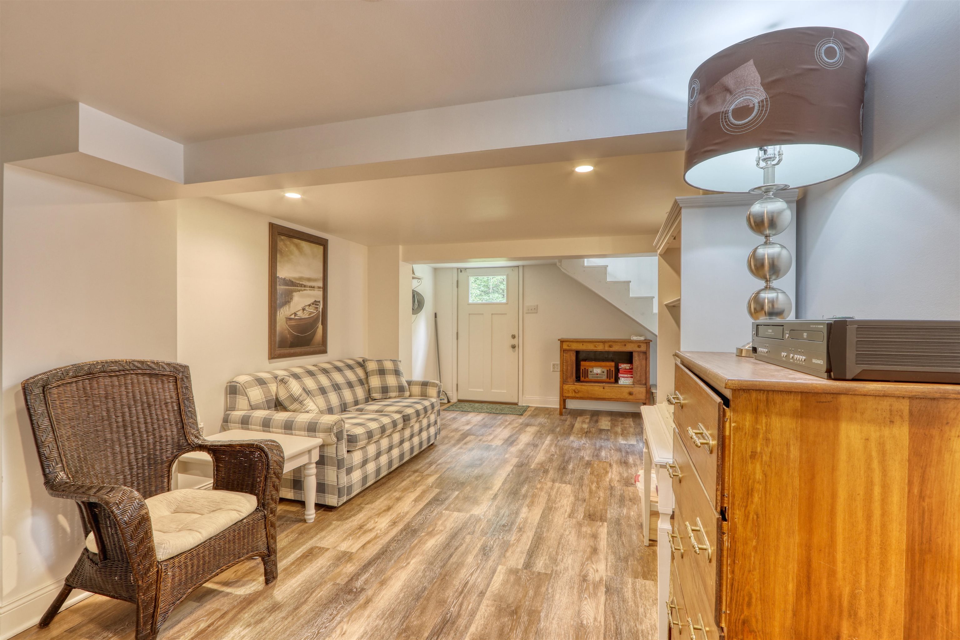7144 Malm Road Winter, WI 54896 - Photo 40 of 58 Living area featuring light wood-style floors, recessed lighting, and stairs