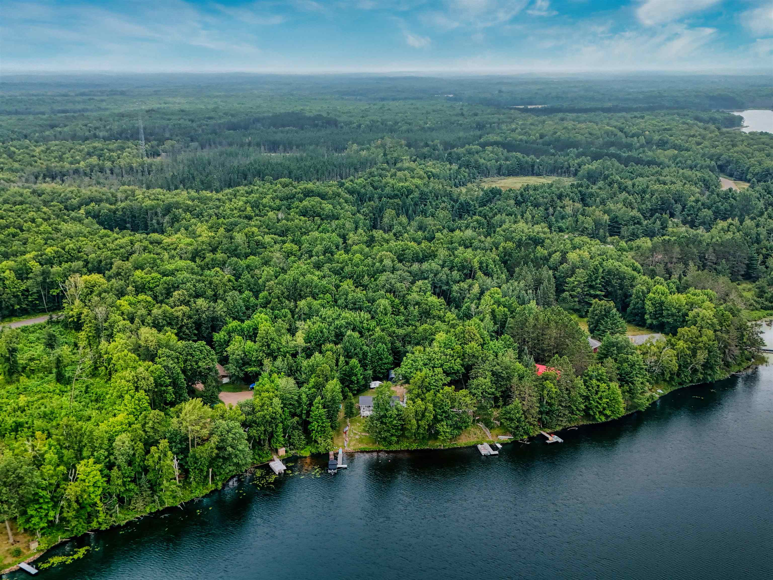 7144 Malm Road Winter, WI 54896 - Photo 43 of 58 Bird's eye view of a forest and a large body of water