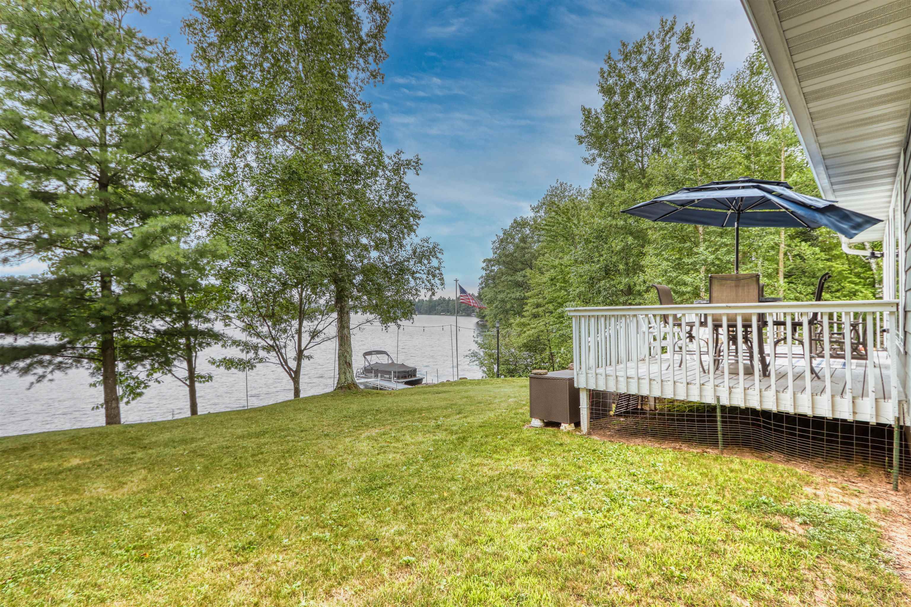 7144 Malm Road Winter, WI 54896 - Photo 52 of 58 View of grassy yard with a deck with water view