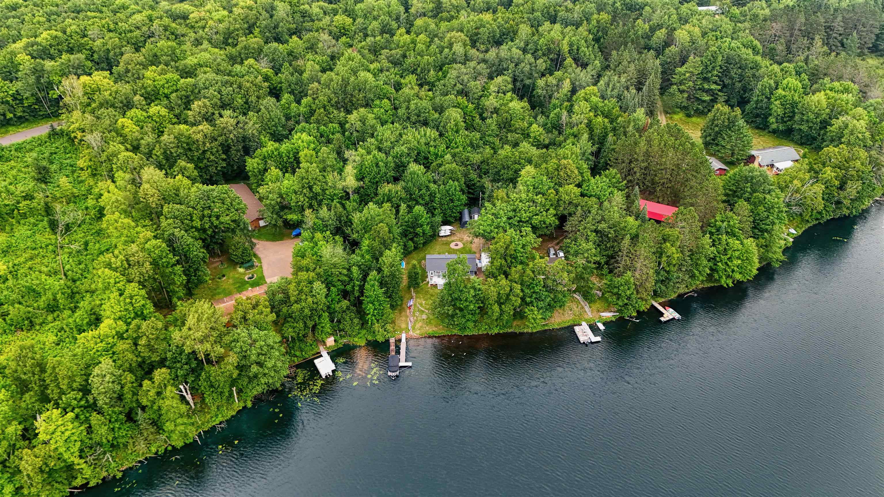 7144 Malm Road Winter, WI 54896 - Photo 10 of 58 Aerial view of property and surrounding area featuring a large body of water