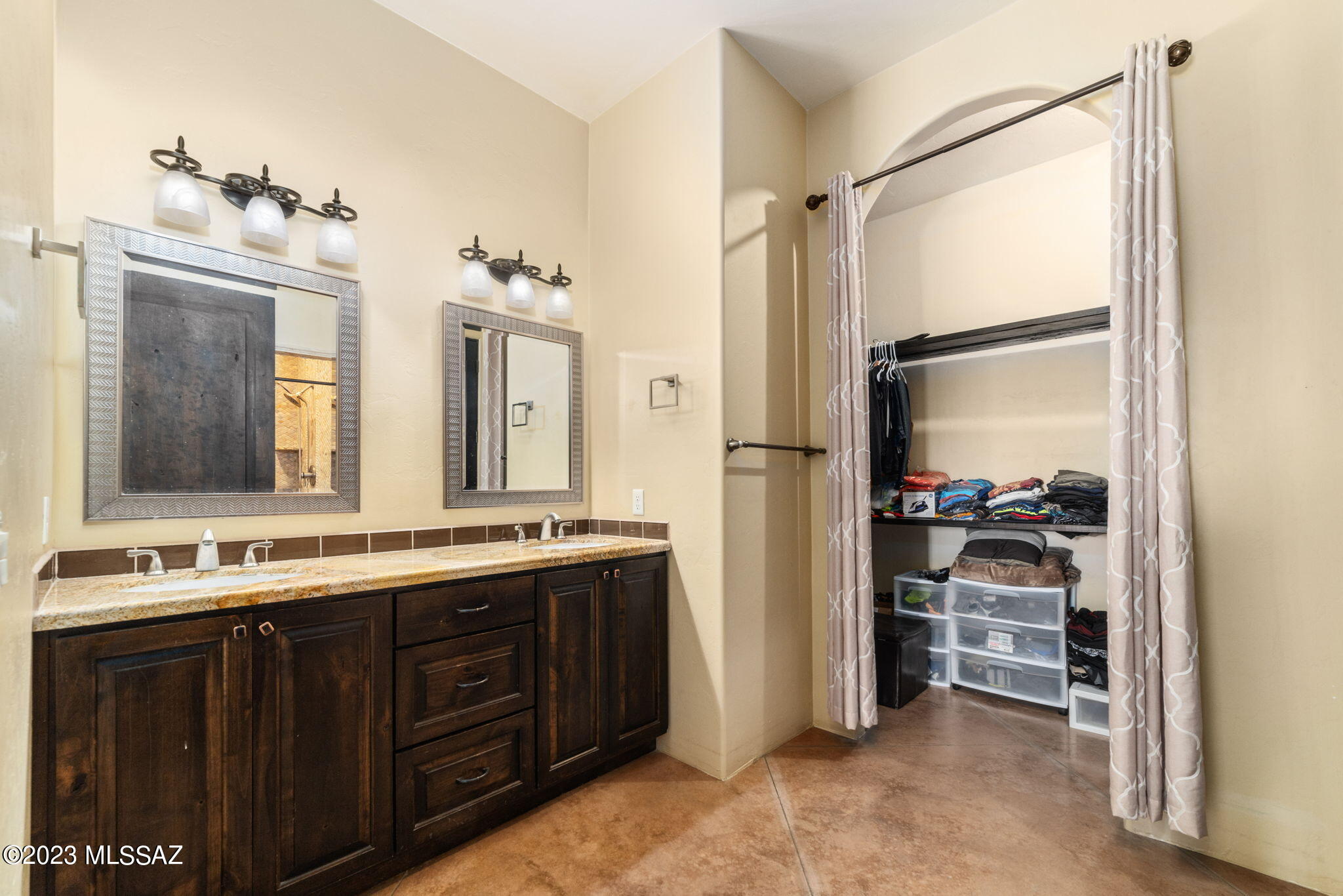 5670 Triangle X Place Tucson, AZ 85713 - Photo 12 of 36 a bathroom with a double vanity sink and a mirror