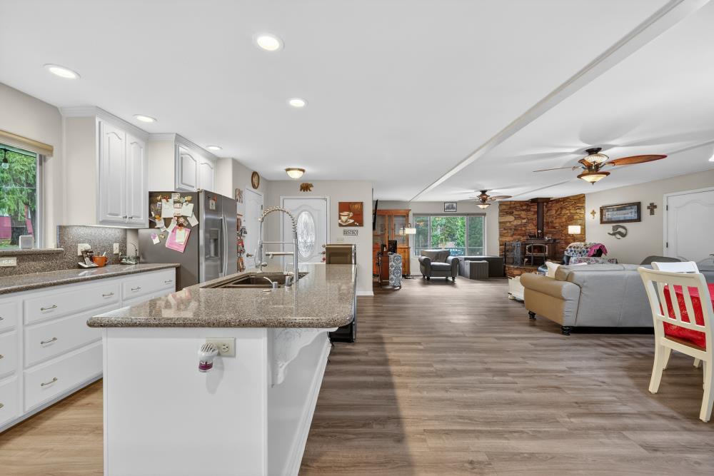 2026 Lily Valley Way West Point, CA 95255 - Photo 20 of 39 a view of living room kitchen with stainless steel appliances granite countertop lots of counter top space