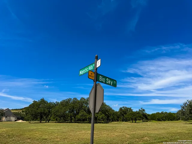 a view of a street with a building in the background