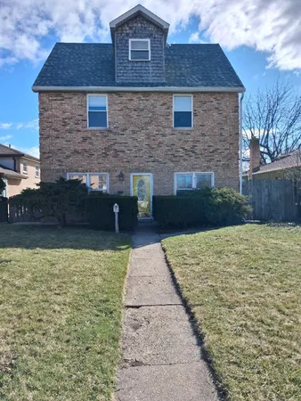 a brick house with a yard