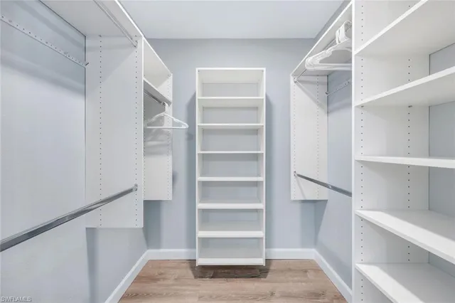 a spacious bathroom with a double vanity sink mirror and double