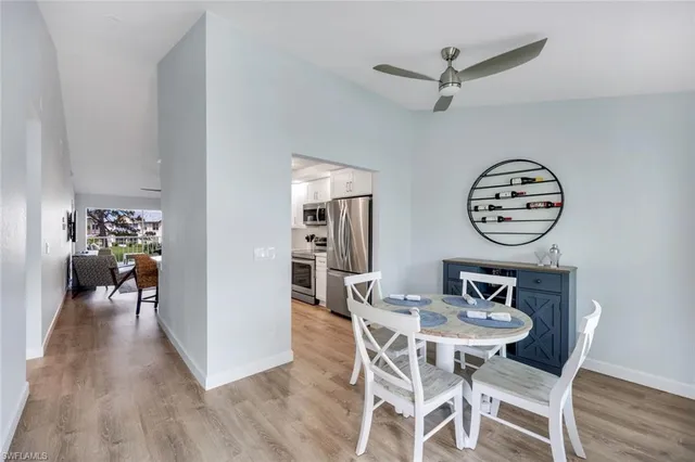 a view of a dining room with furniture and wooden floor