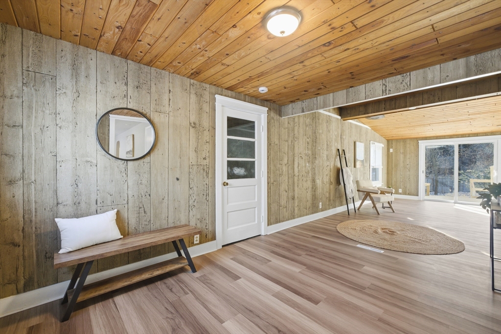 4 Smith Street Attleboro, MA 02703 - Photo 19 of 20 a bedroom with a bed a mirror and a window