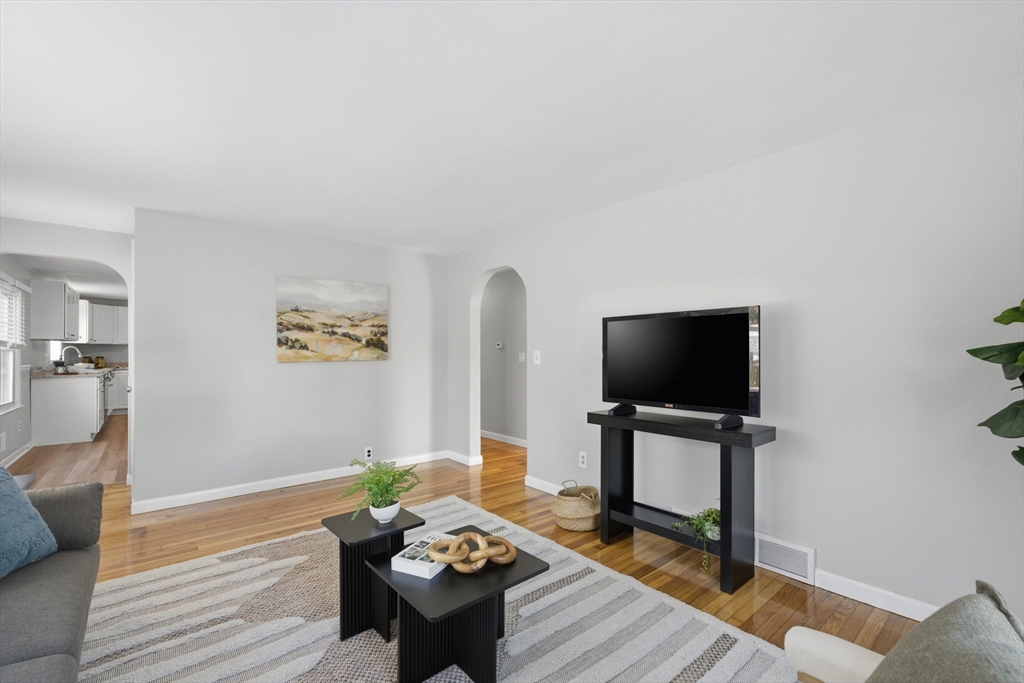 4 Smith Street Attleboro, MA 02703 - Photo 5 of 20 a living room with furniture and a flat screen tv