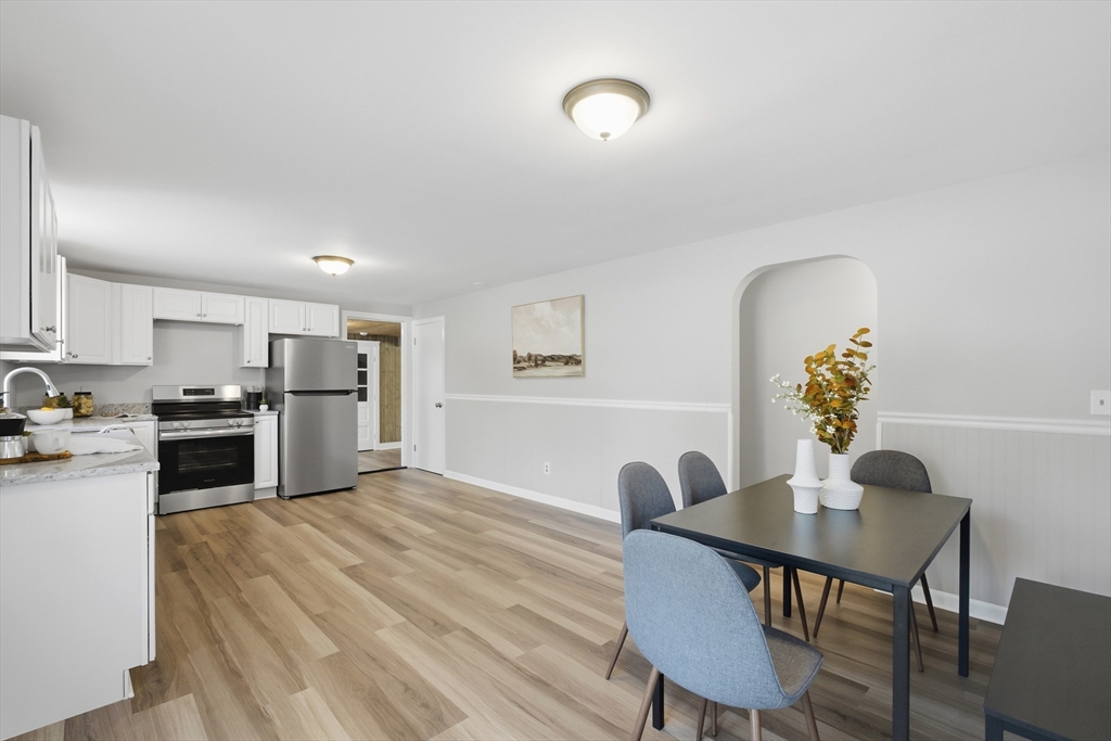 4 Smith Street Attleboro, MA 02703 - Photo 7 of 20 a open dining room with wooden floor furniture and kitchen view