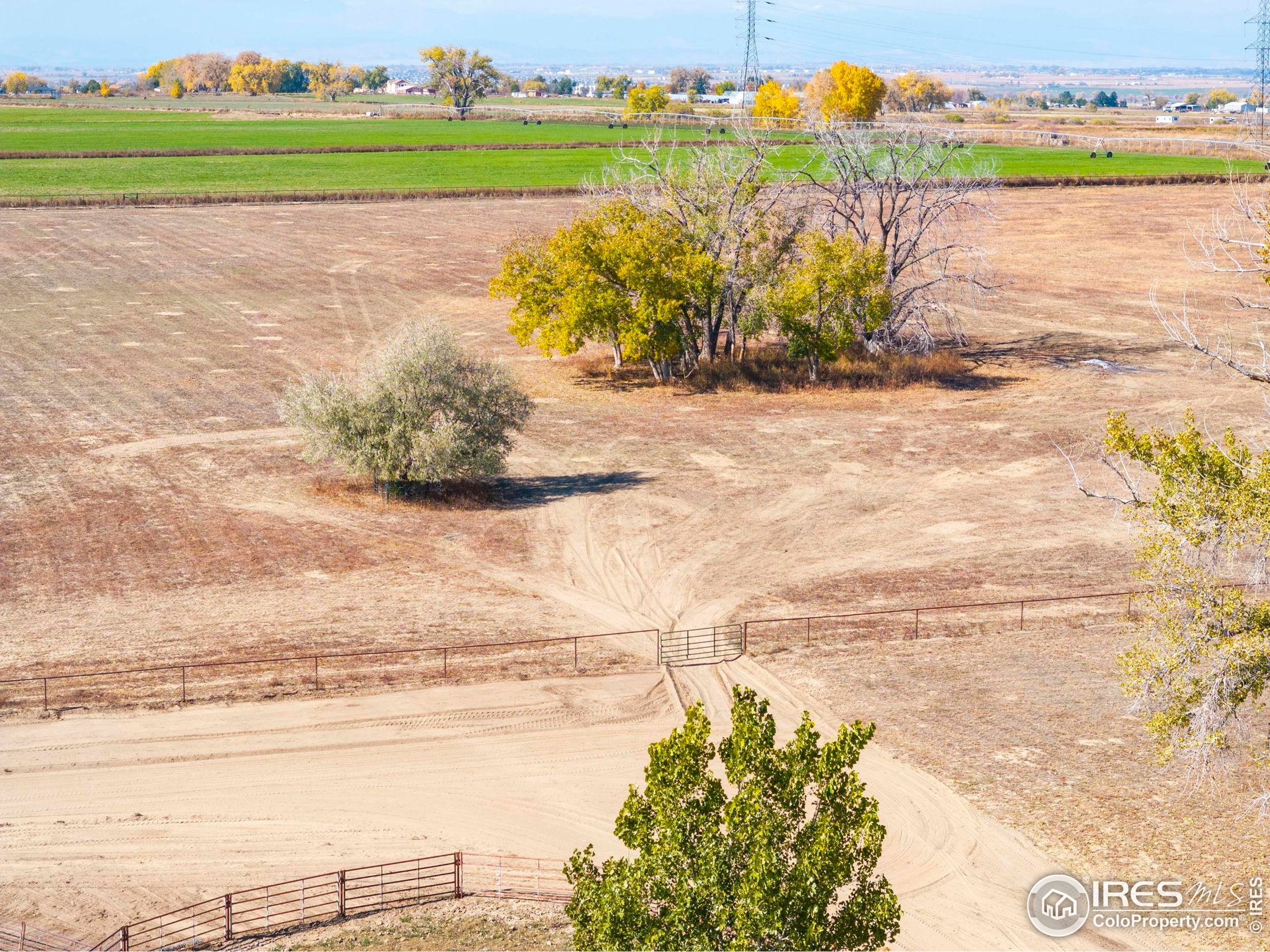 9875 County Road 24 Fort Lupton, CO 80621 - Photo 11 of 50 a view of a lake with a beach