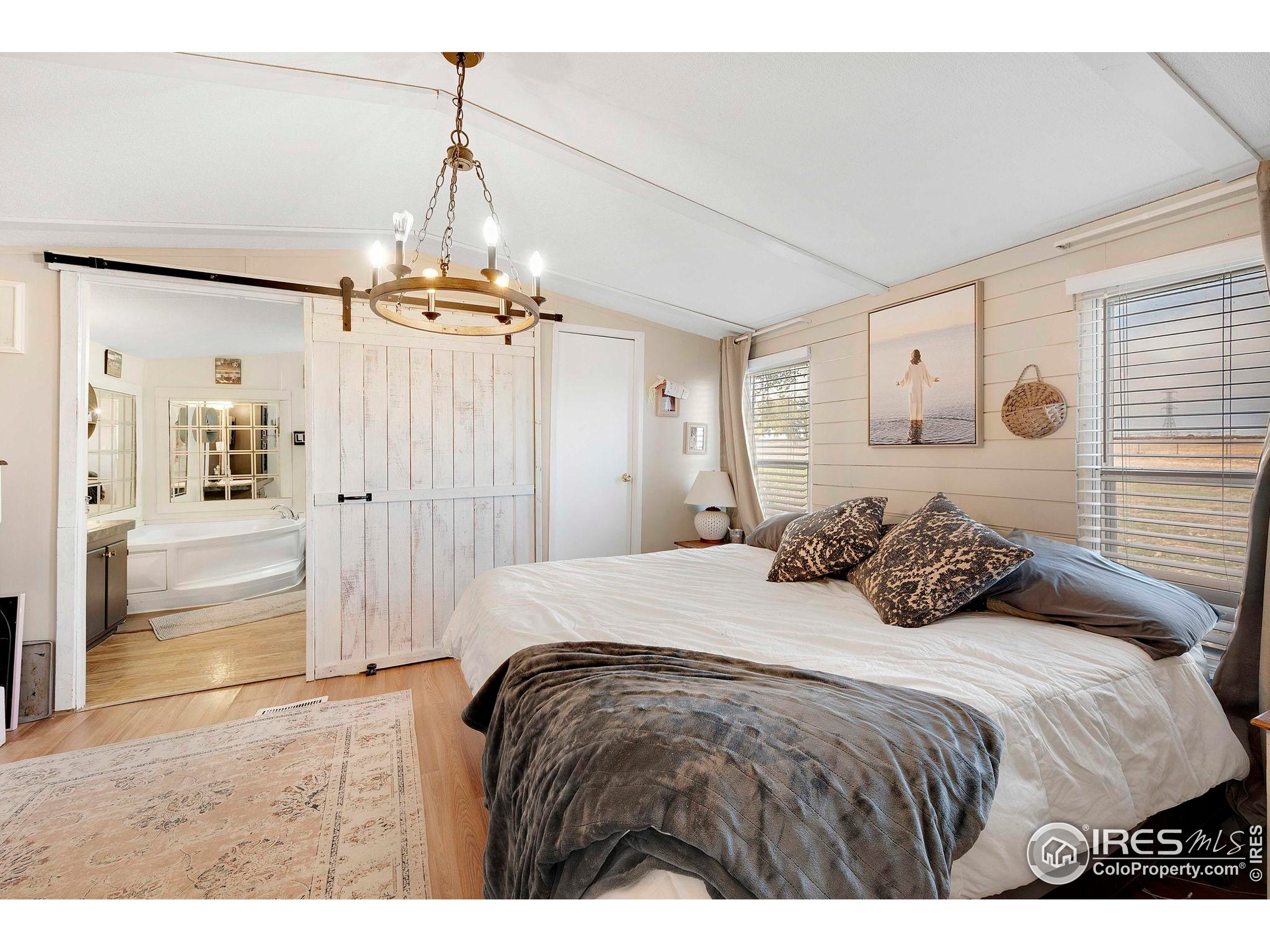 9875 County Road 24 Fort Lupton, CO 80621 - Photo 32 of 50 a bedroom with a bed and a shower