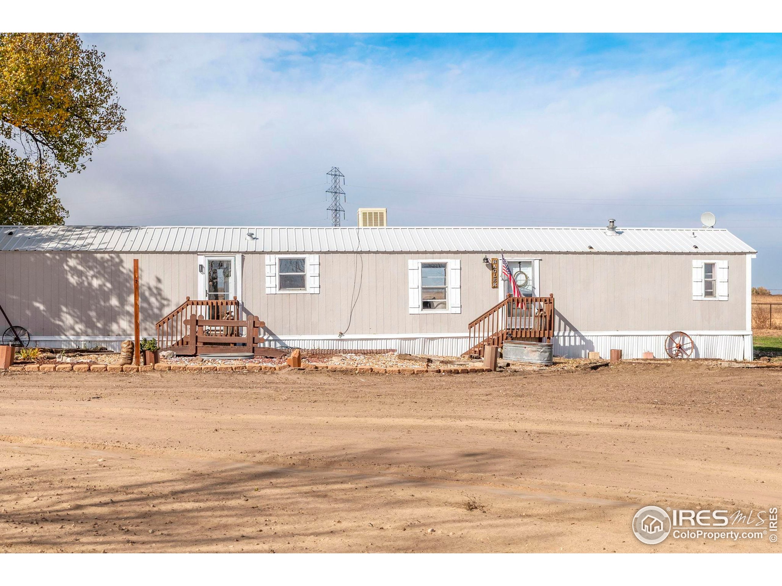9875 County Road 24 Fort Lupton, CO 80621 - Photo 47 of 50 a view of a livingroom with wooden floor