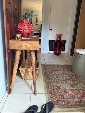 a view of living room with furniture and wooden floor