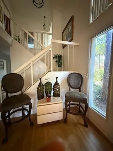 a bedroom with furniture and a window
