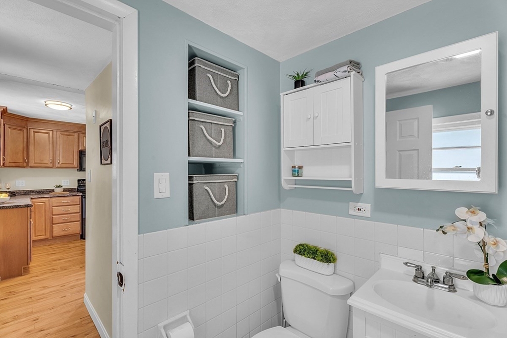 898 Boston Road Billerica, MA 01821 - Photo 13 of 38 a bathroom with a sink a toilet and shower