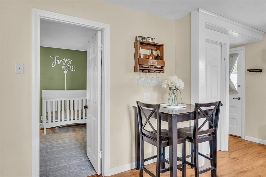 898 Boston Road Billerica, MA 01821 - Photo 14 of 38 a view of a dining room with furniture and wooden floor