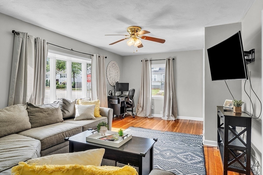 898 Boston Road Billerica, MA 01821 - Photo 19 of 38 a living room with furniture fireplace and a flat screen tv