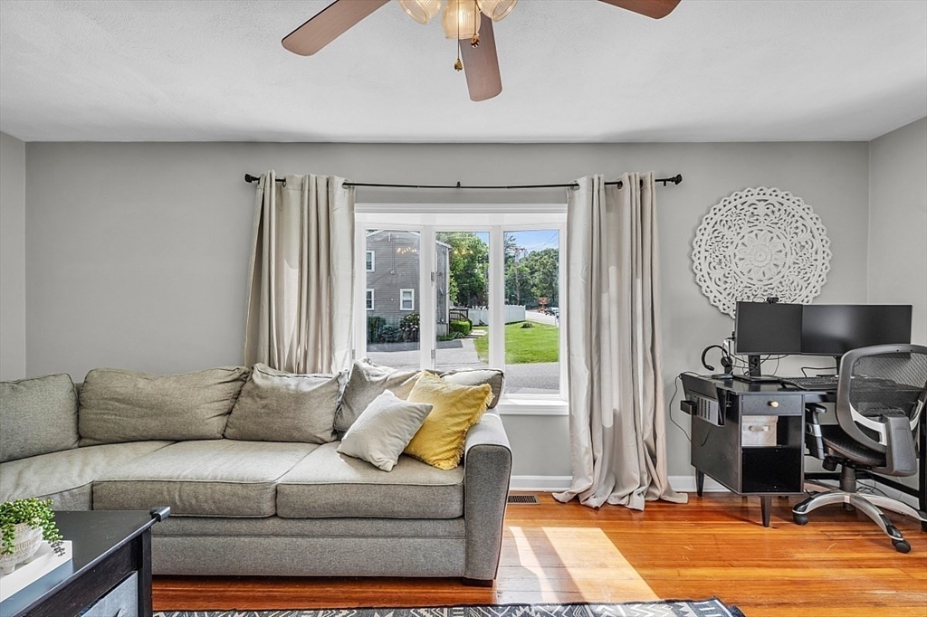 898 Boston Road Billerica, MA 01821 - Photo 20 of 38 a living room with furniture and a large window