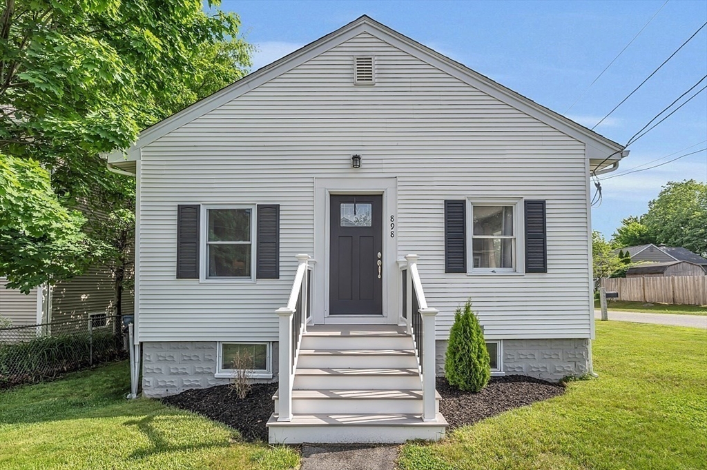 898 Boston Road Billerica, MA 01821 - Photo 2 of 38 a front view of a house with a yard