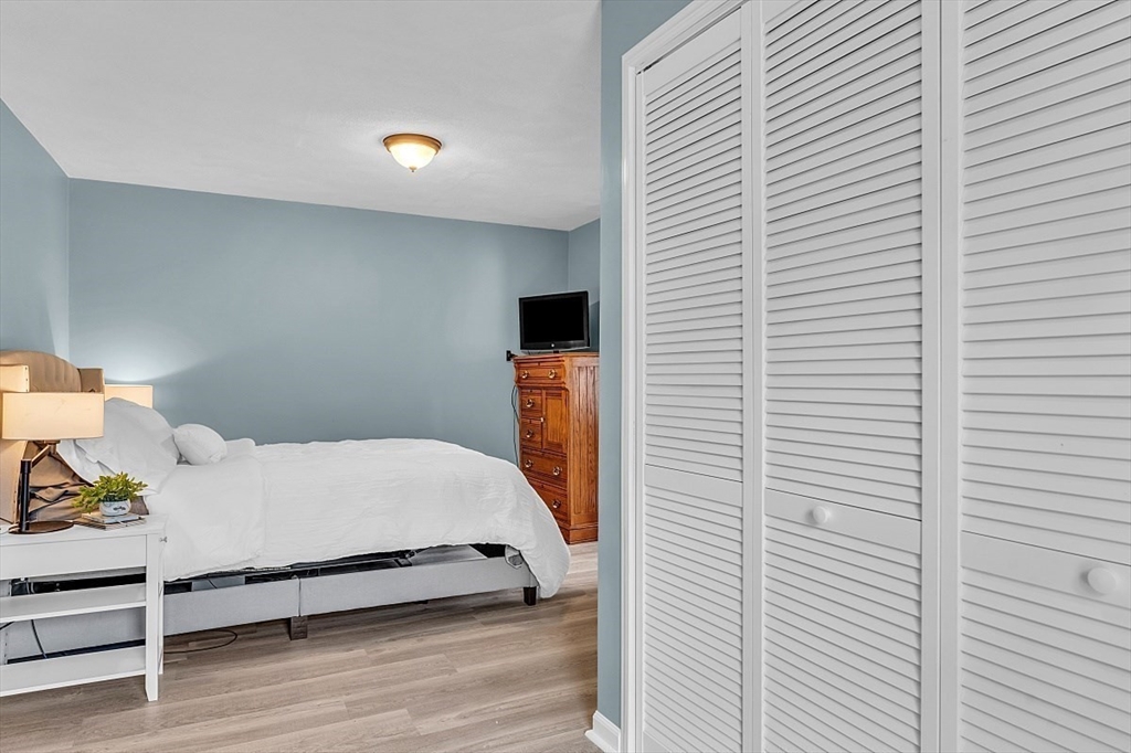 898 Boston Road Billerica, MA 01821 - Photo 24 of 38 a bedroom with a bed and a potted plant