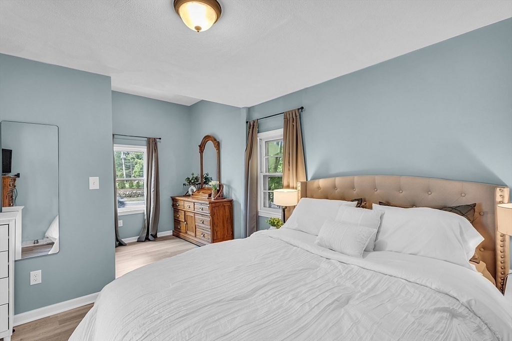 898 Boston Road Billerica, MA 01821 - Photo 25 of 38 a bedroom with a bed and a dresser