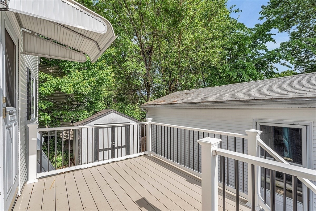 898 Boston Road Billerica, MA 01821 - Photo 27 of 38 a view of a wooden deck and a yard