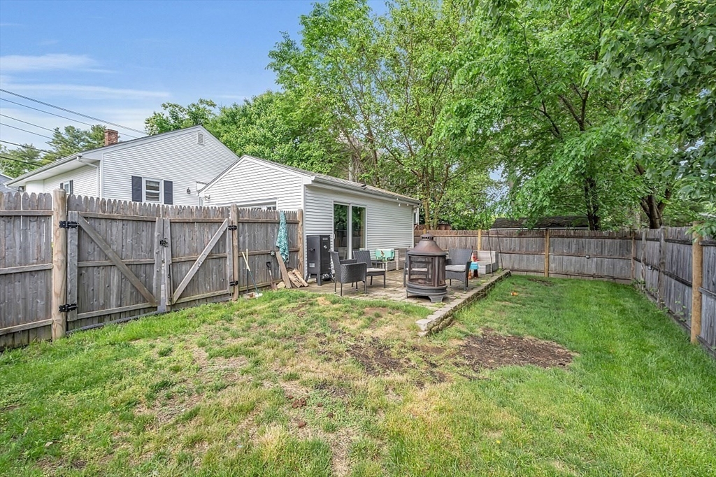 898 Boston Road Billerica, MA 01821 - Photo 30 of 38 a view of a yard with wooden fence and a large tree