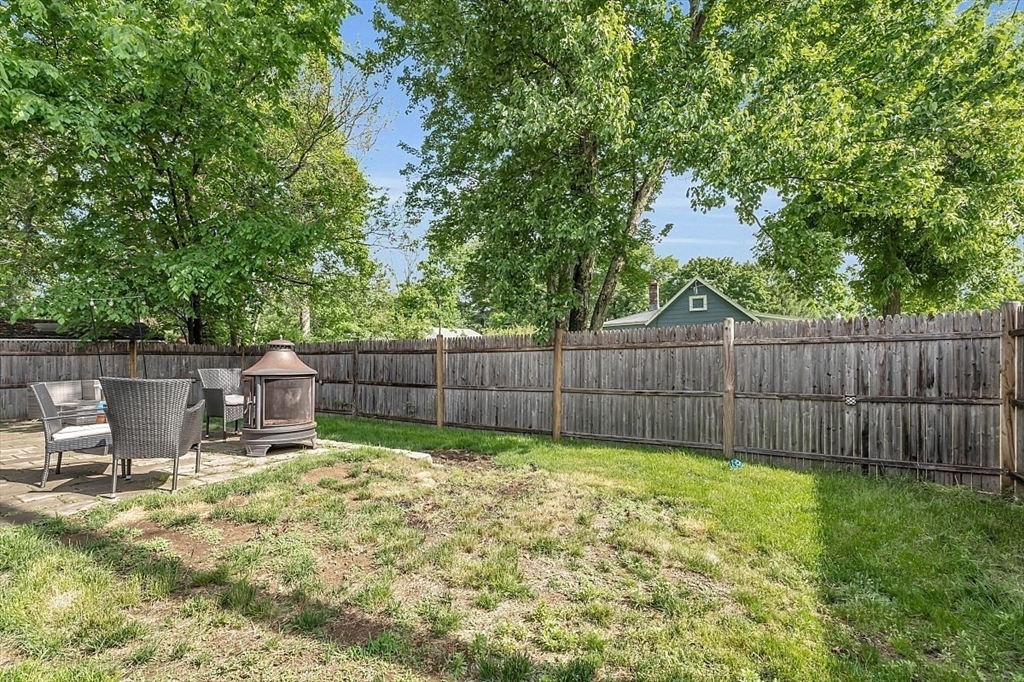 898 Boston Road Billerica, MA 01821 - Photo 31 of 38 a view of a backyard with a small cabin and a chair