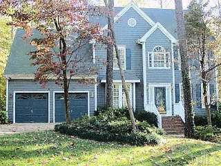 12221 Warwickshire Way Raleigh, NC 27613 - Photo 1 of 1 a front view of a house with garden