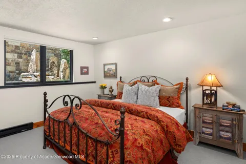 a backyard of a house with lots of green space and trees