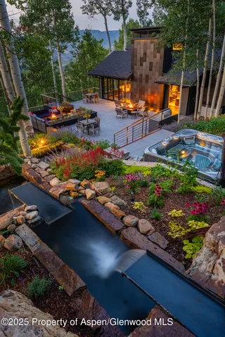 a view of a backyard with a patio and outdoor seating