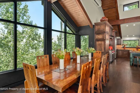 a view of a dining room with furniture window and outside view