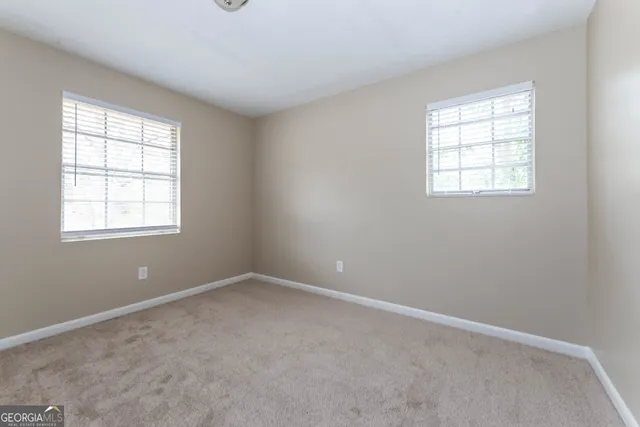 an empty room with windows