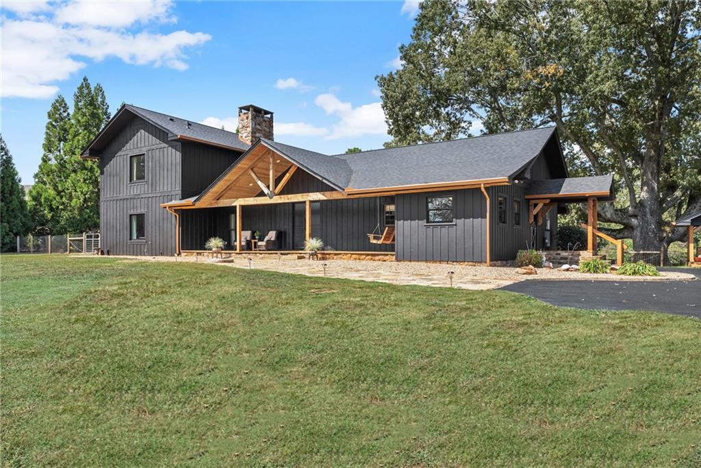6537 Kenimer Road Clermont, GA 30527 - Photo 1 of 1 a front view of a house with a yard