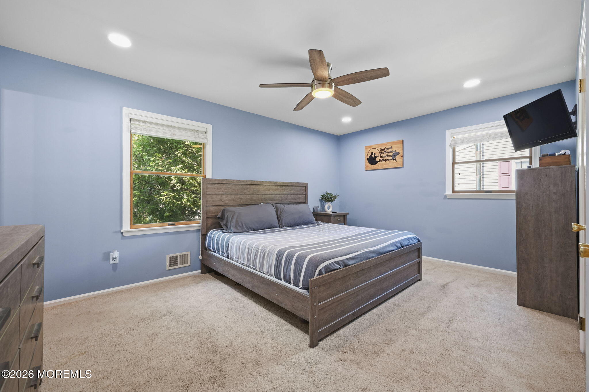 356 Leesville Road Jackson, NJ 08527 - Photo 21 of 46 a spacious bedroom with a bed flat screen tv and windows