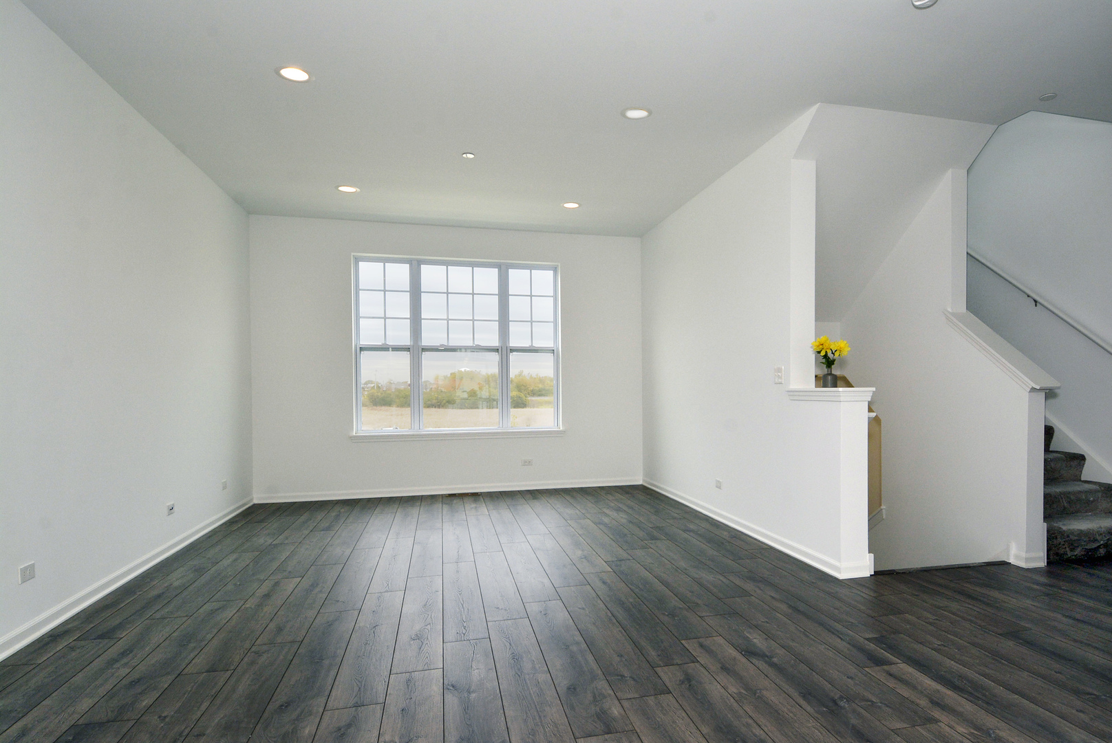 309 Timberleaf Circle Roselle, IL 60172 - Photo 2 of 16 an empty room with wooden floor and windows