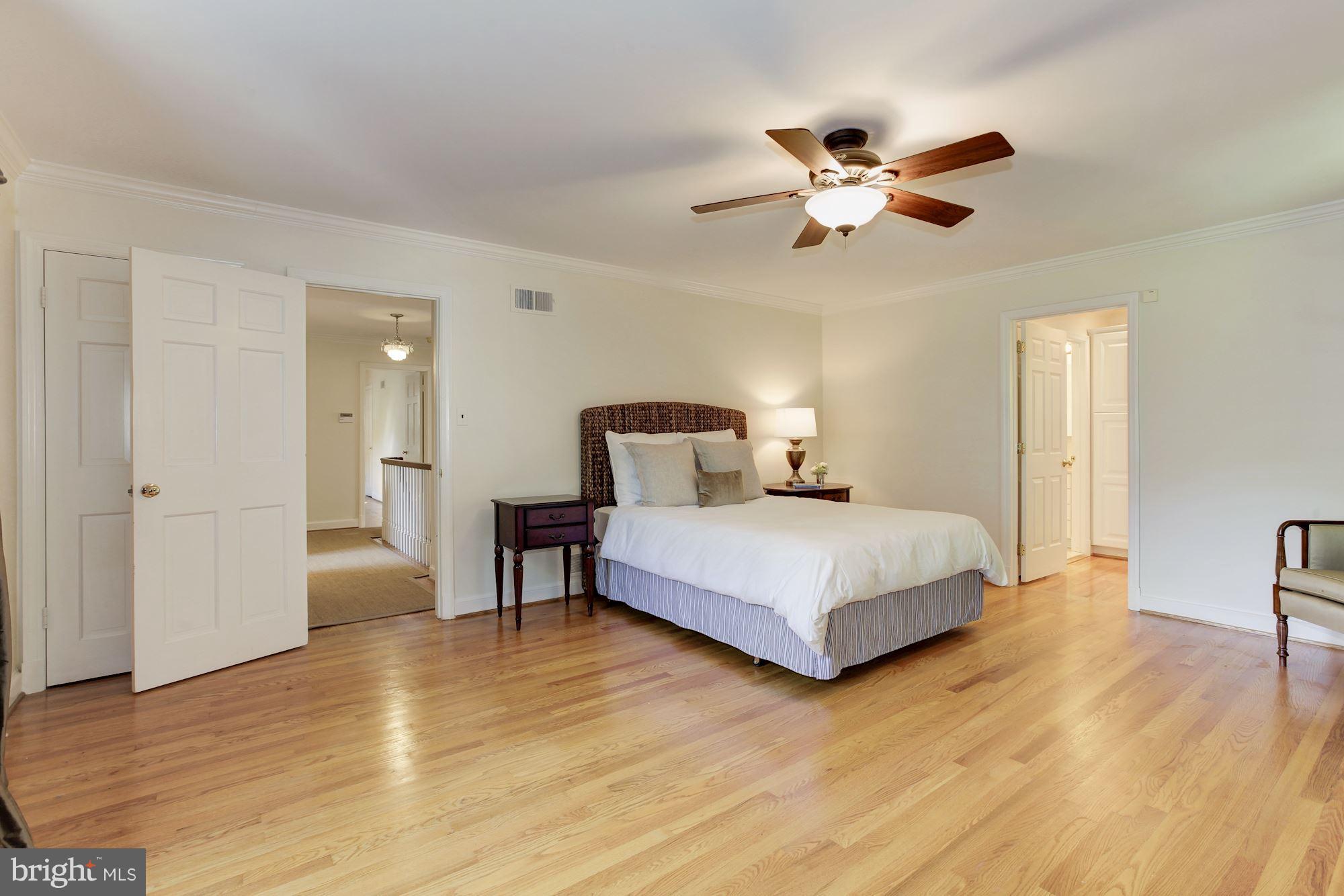 5509 Center Street Chevy Chase, MD 20815 - Photo 15 of 30 a bedroom with a bed and wooden floor