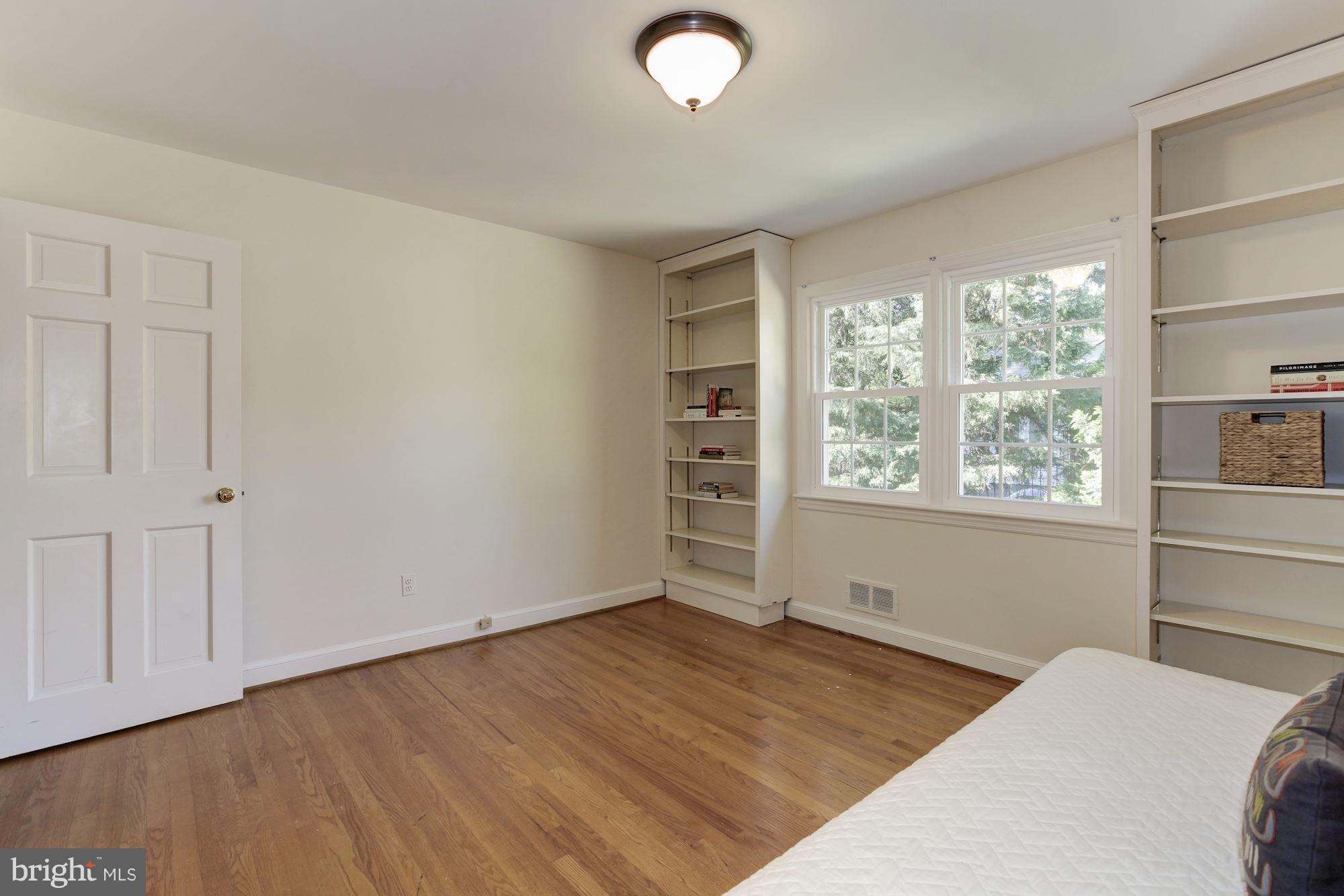5509 Center Street Chevy Chase, MD 20815 - Photo 18 of 30 a bedroom with a bed and a window
