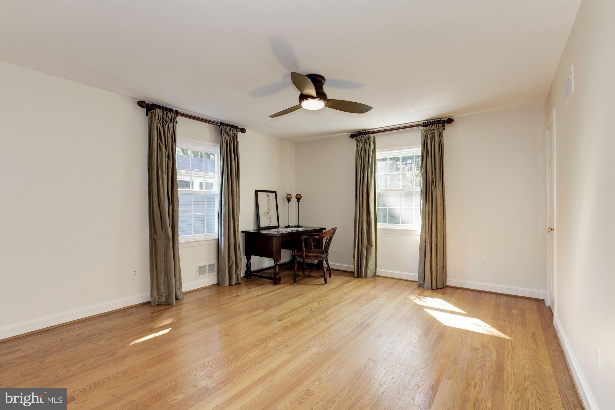 5509 Center Street Chevy Chase, MD 20815 - Photo 20 of 30 wooden floor in an empty room with a window