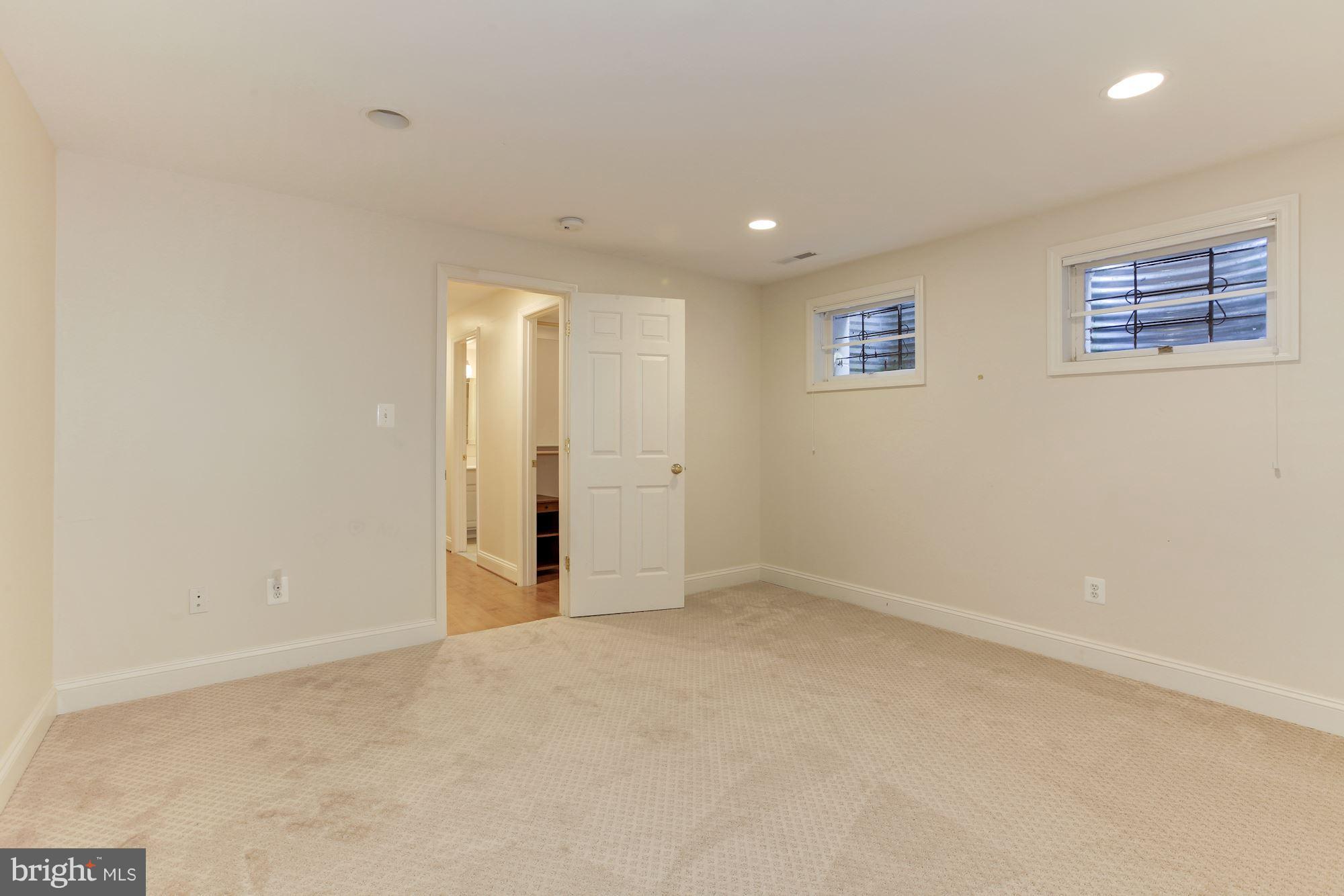 5509 Center Street Chevy Chase, MD 20815 - Photo 24 of 30 an empty room with windows and closet