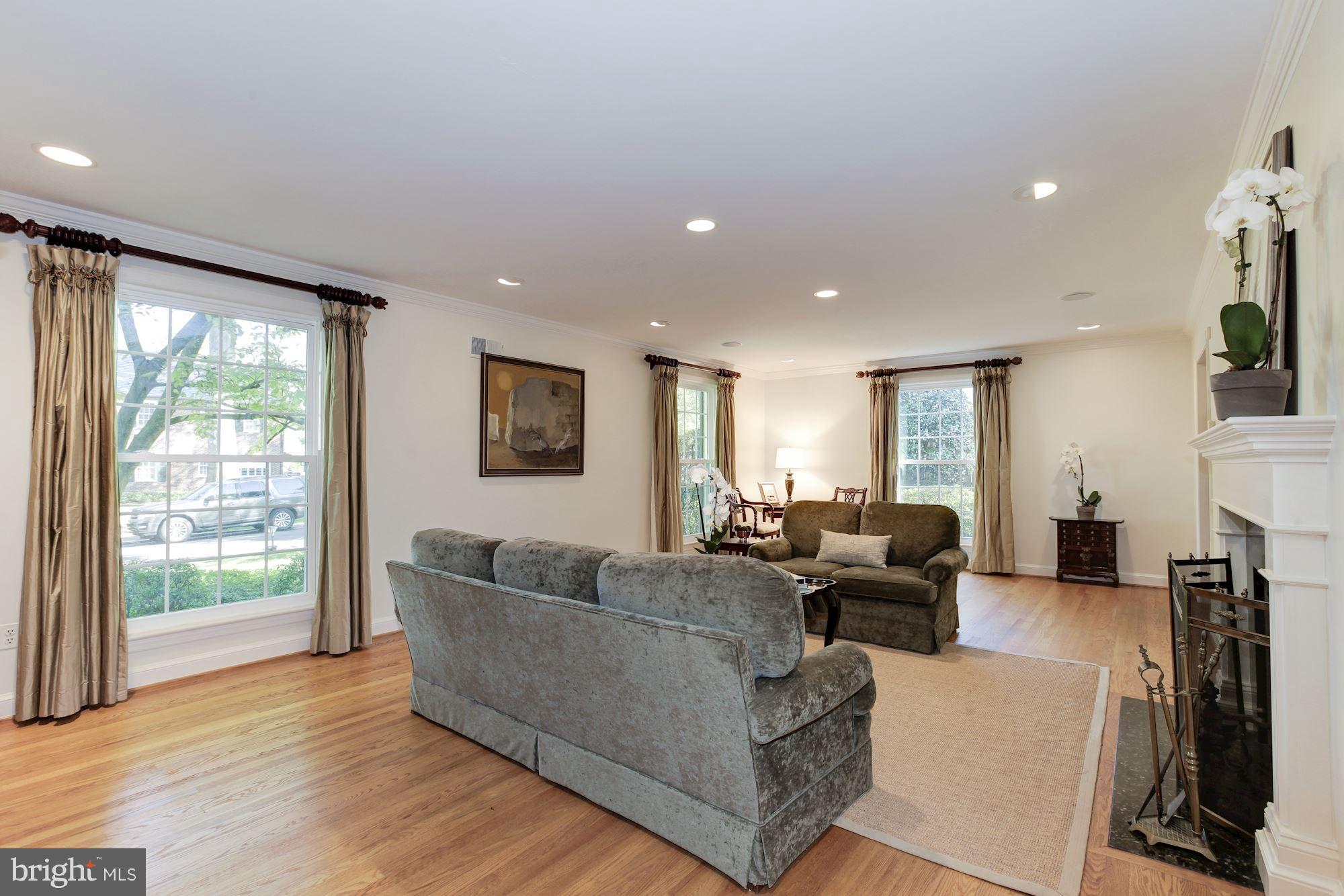 5509 Center Street Chevy Chase, MD 20815 - Photo 5 of 30 a living room with fireplace furniture and a large window